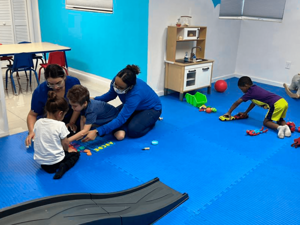 Trainers performing a Play ABA skill Training